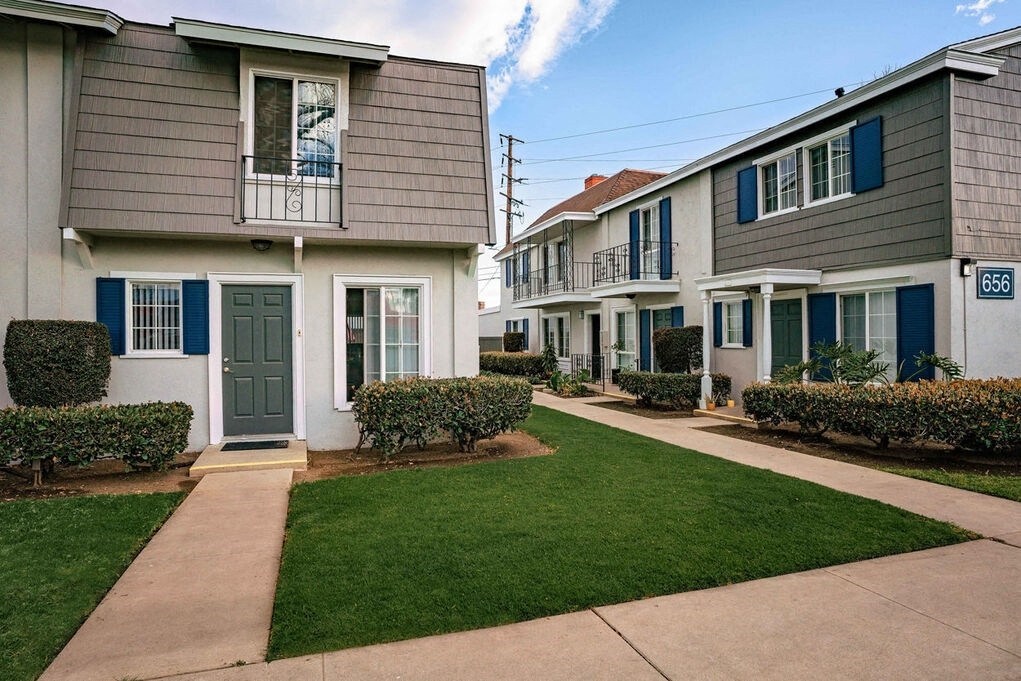 A row of houses with blue shutters and a number 656 on the front at Nola 624 Apartments, West Covina, 91790