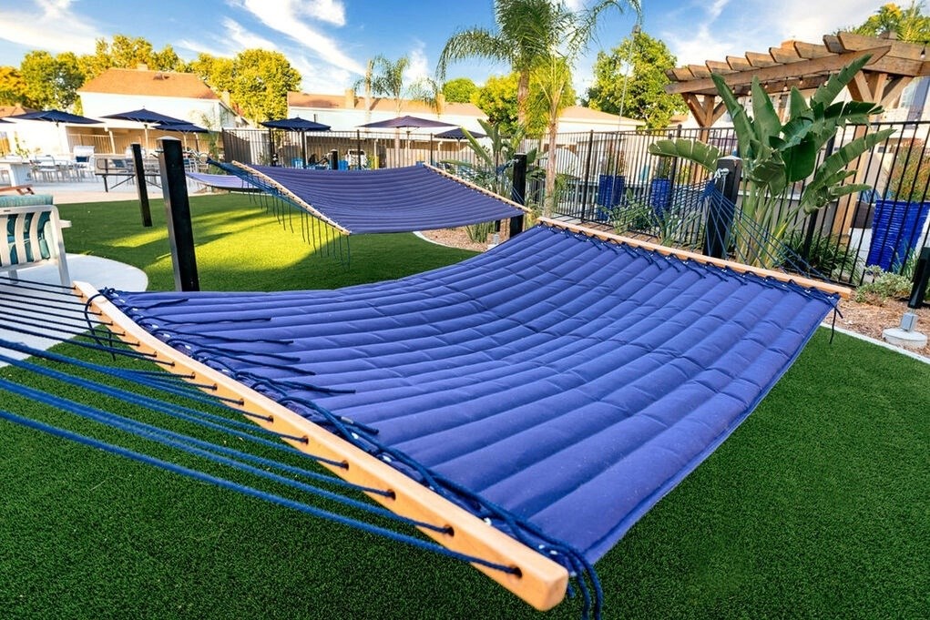 A blue inflatable slide in a backyard at Nola 624 Apartments, West Covina, CA, 91790