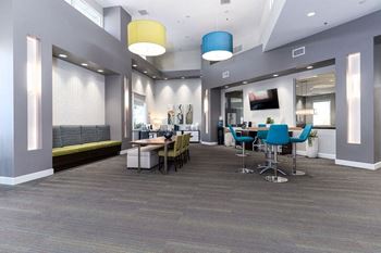 A conference room with a long table and chairs at Nola 624 Apartments, West Covina, 91790