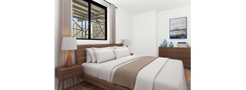 A bedroom with a large bed and a painting on the wall.