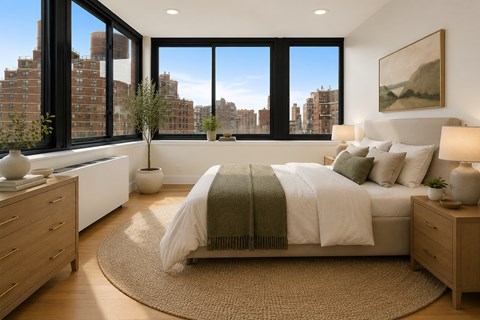 A bedroom with a large bed and a view of the city.