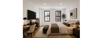 A modern bedroom with a large bed and a flat screen TV.