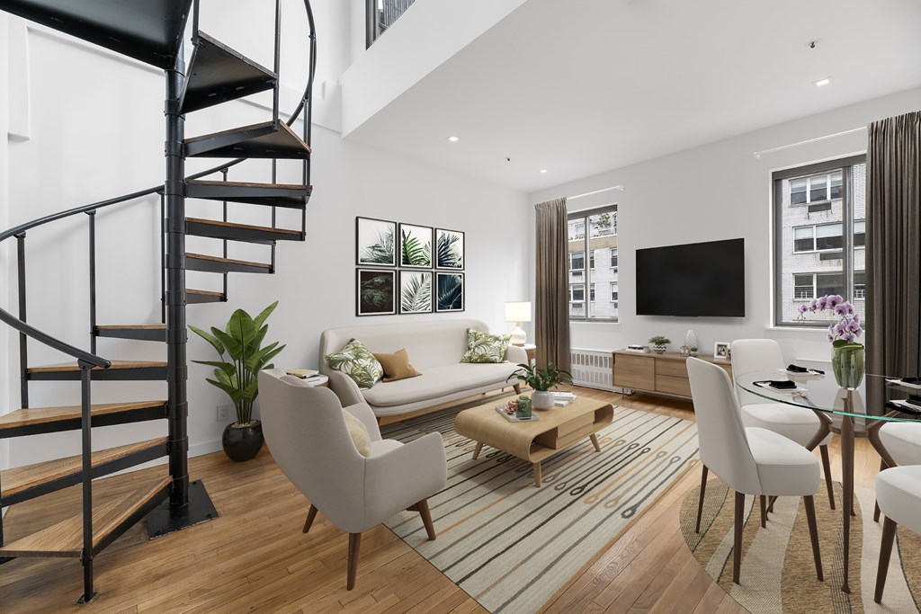 A modern living room with a spiral staircase.