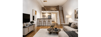 A living room with a staircase leading to the upper floor.