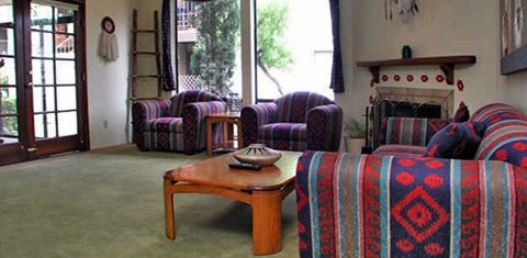 A living room with a fireplace and a couch.
