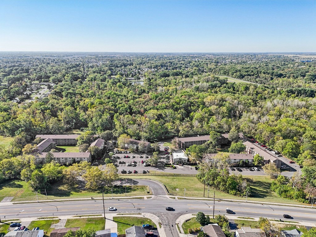 A bird's eye view of a residential area with houses and trees.