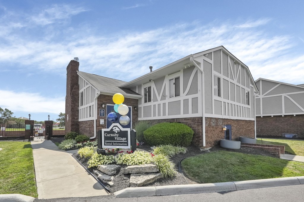 The image shows a building with a sign that reads