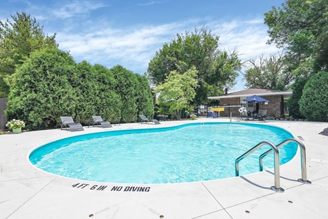 A pool with a no diving sign on the side.