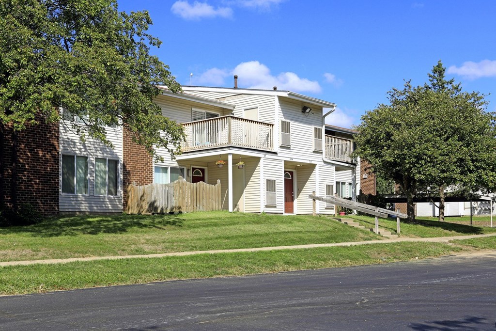 a white house on the side of a street