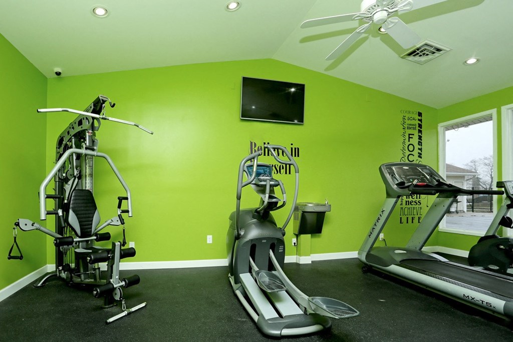 the gym at the west end of the home has a treadmill and weights