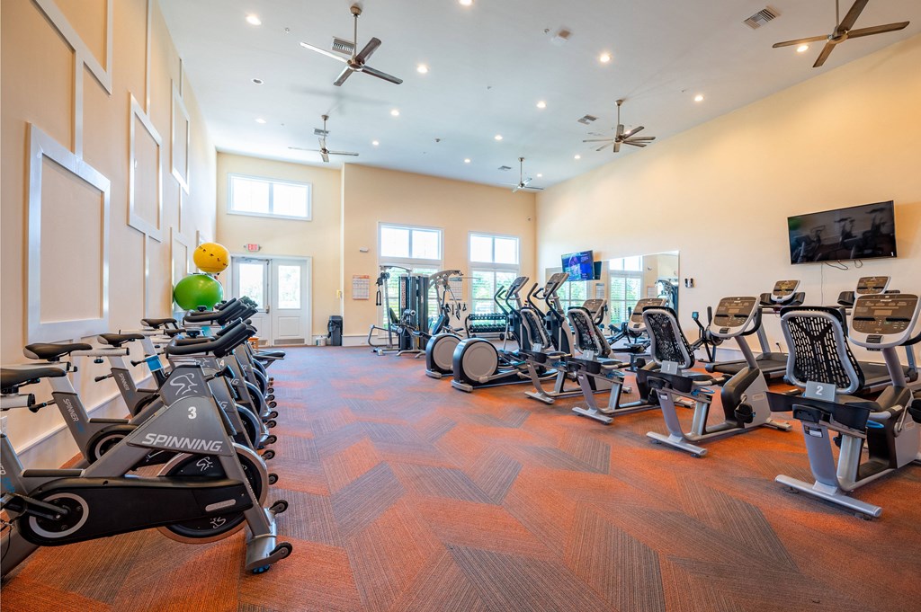a gym with cardio equipment and exercise machines
