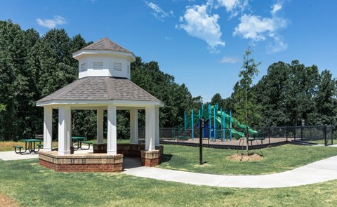 a park with a gazebo and a playground