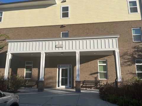 A building with the number 1224 on the front.