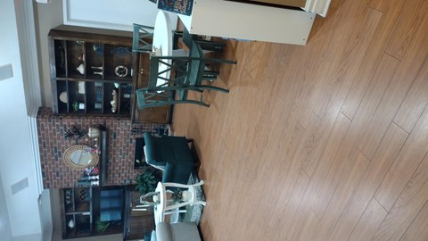 A living room with a couch and a chair.