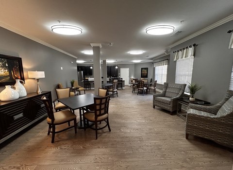 A well-lit dining area with a table set for six.