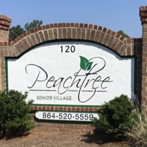 the sign at the entrance to the pear tree senior village