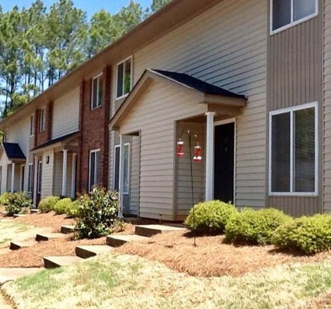 a house with a front porch and steps to it