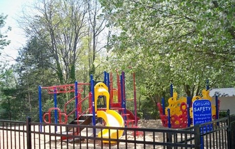 a playground at a park with slides and other playground equipment