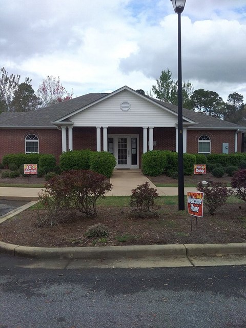a house with two signs in front of it