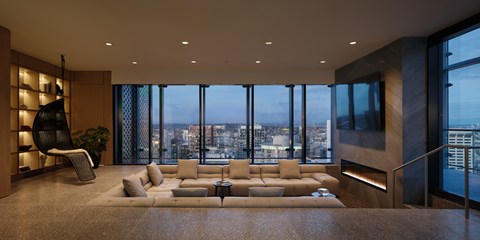 A modern living room with a large window overlooking the city.