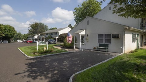 A white building with a flag on it.