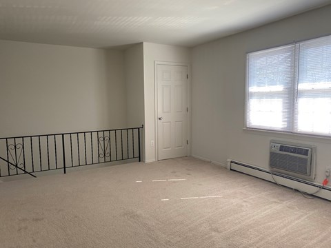 Empty room with a window and a door.