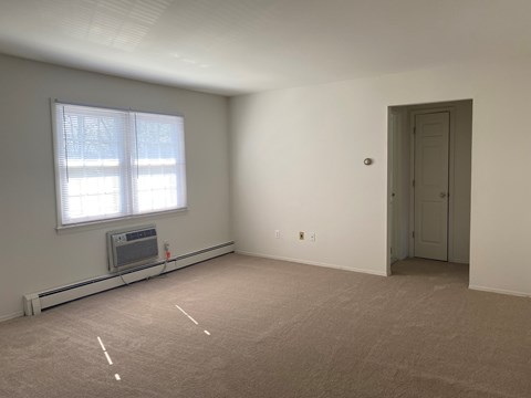 A room with a window and a door.