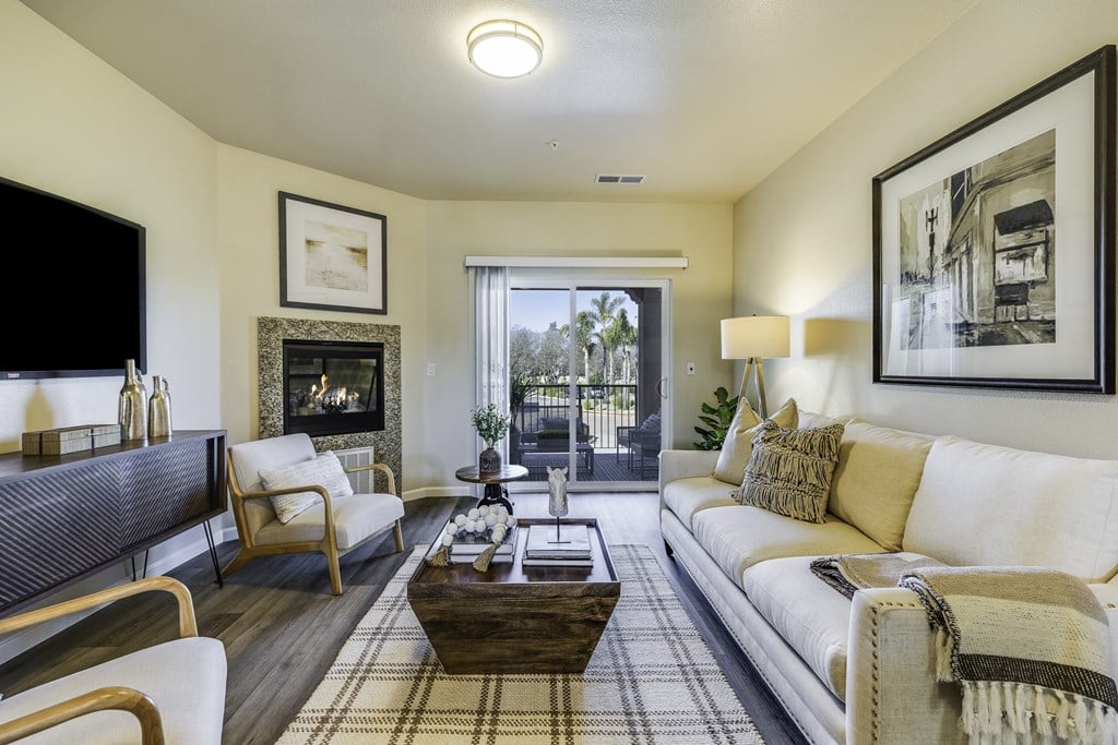 A living room with a fireplace and a couch.