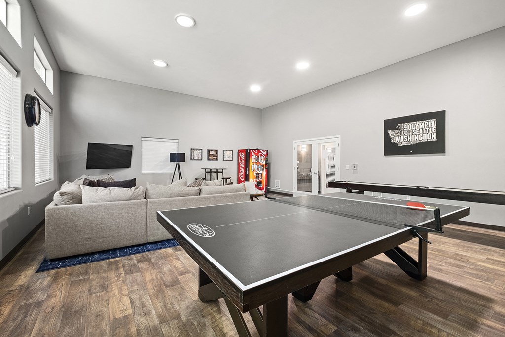 our apartments have a game room with a ping pong table and a flat screen tv at Mill Pond Apartments, Washington, 98092