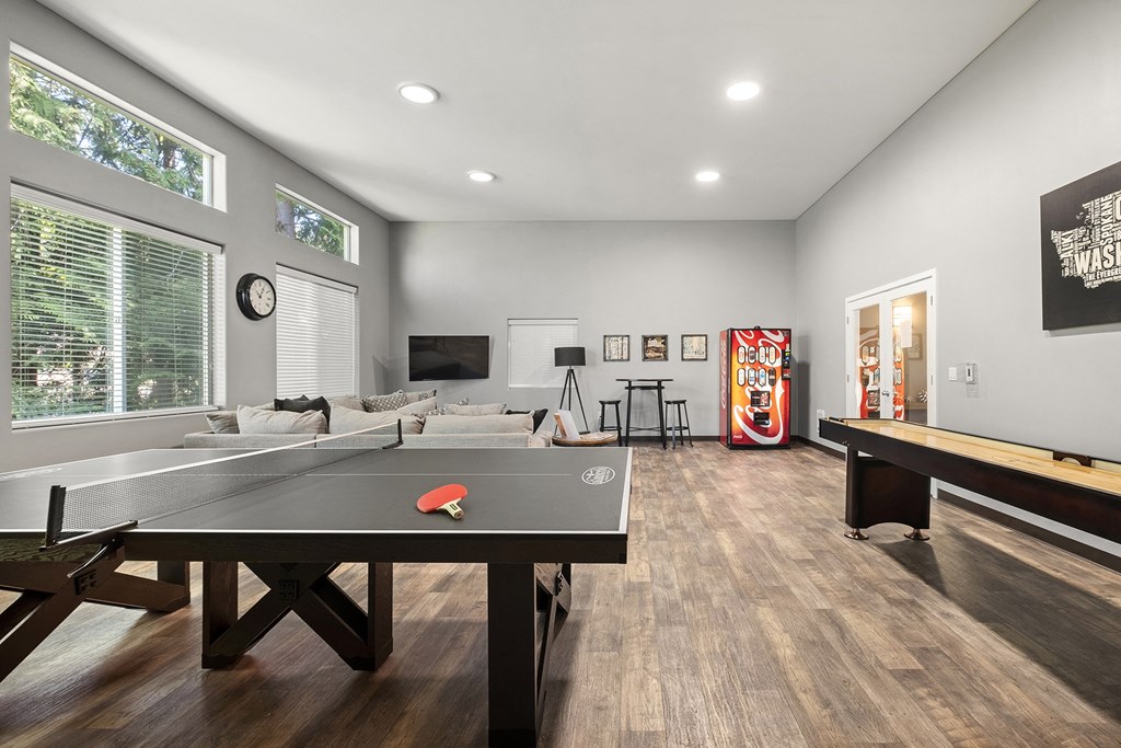 a games room with a ping pong table and a foosball table at Mill Pond Apartments, Washington