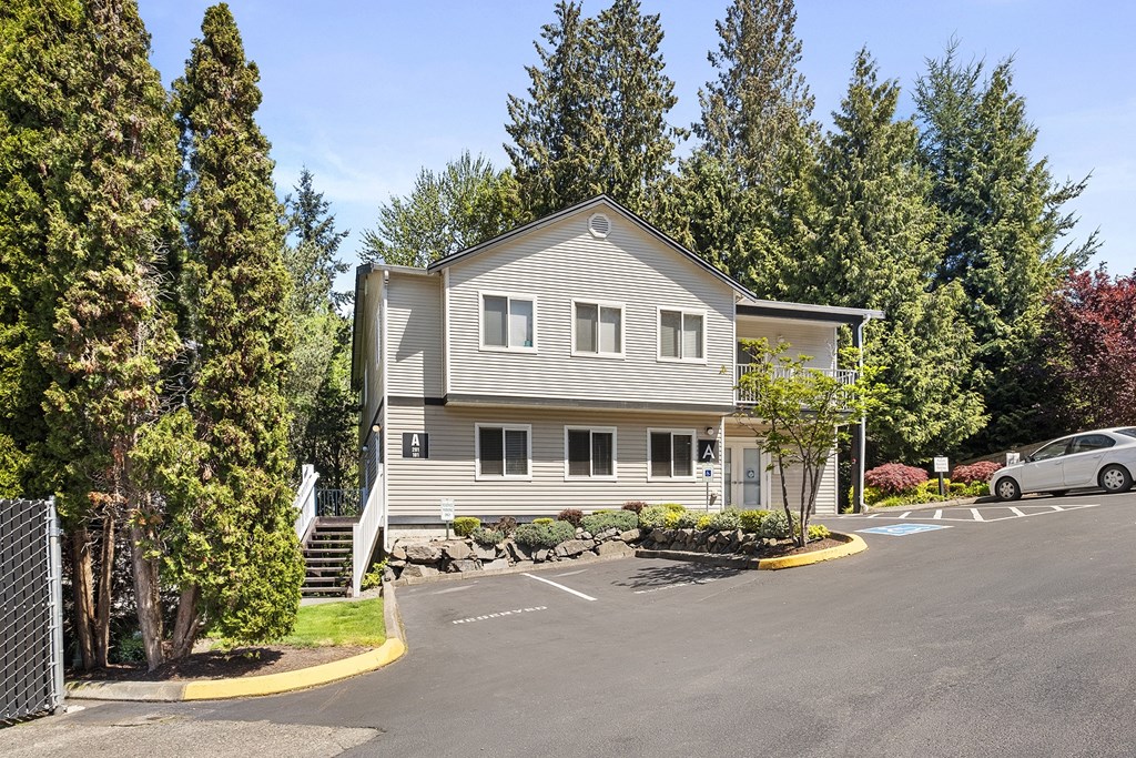 a house with a parking lot in front of it at Mill Pond Apartments, Auburn Washington