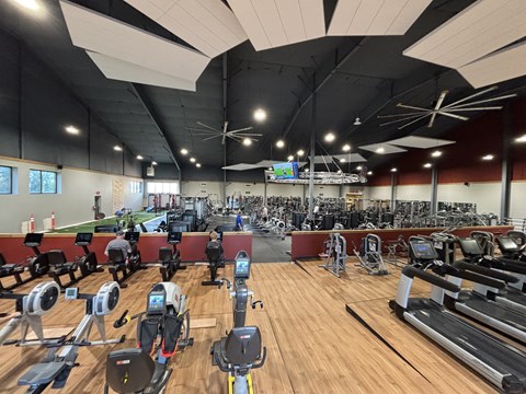A gym with a variety of exercise equipment including treadmills, stationary bikes, and weight machines.at Ironwood Apartments, Coeur d'Alene, 83814