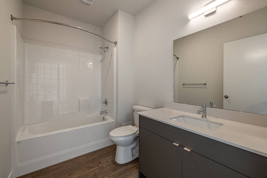 a bathroom with a sink toilet and a tub at Sagecrest Apartments, Wenatchee