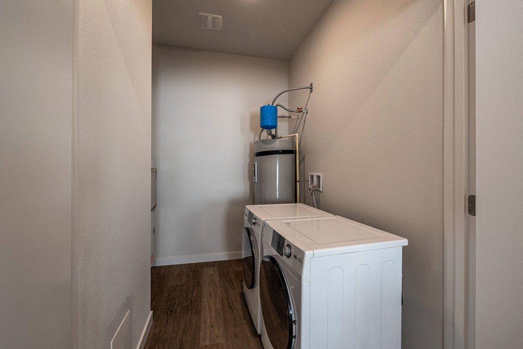 a laundry room with a washer and dryer in a house at Sagecrest Apartments, Wenatchee, WA