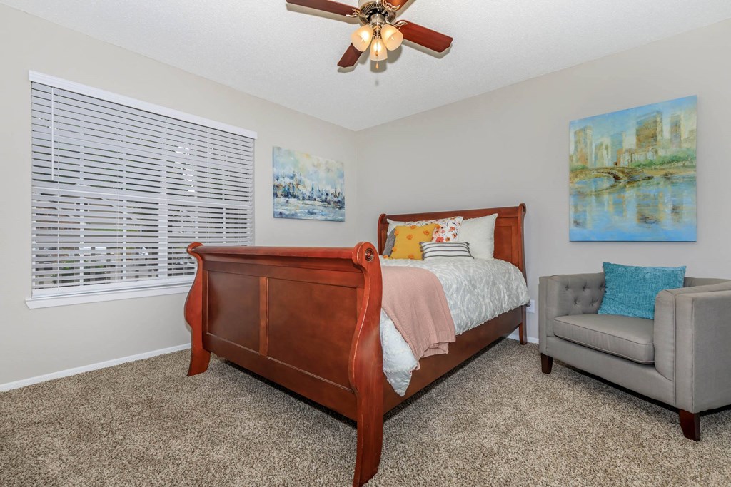 a bedroom with a bed and a ceiling fan at The Davis Apartments, Alabama, 35816