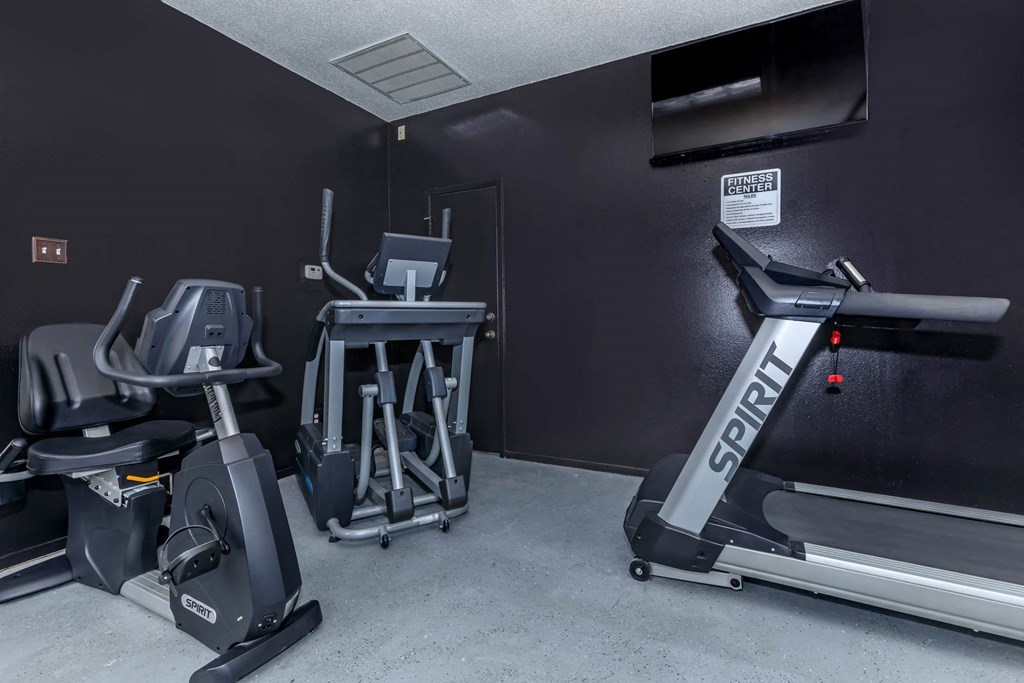the gym has plenty of exercise equipment in it at The Davis Apartments, Huntsville Alabama  