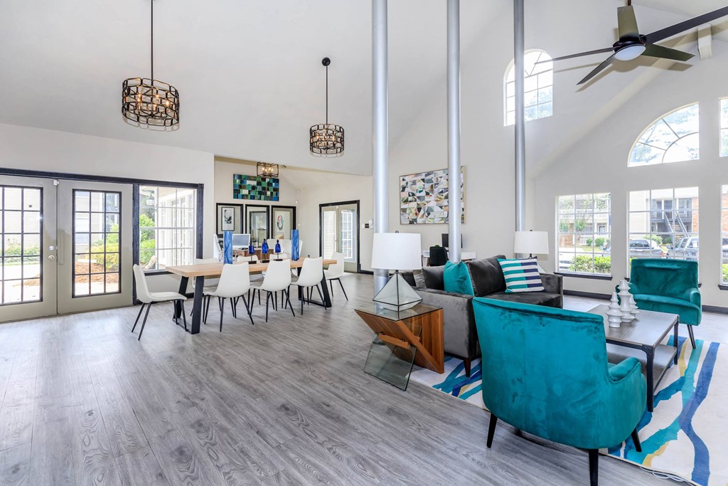 a living room and dining room with a table and chairs at The Davis Apartments, Huntsville, 35816  