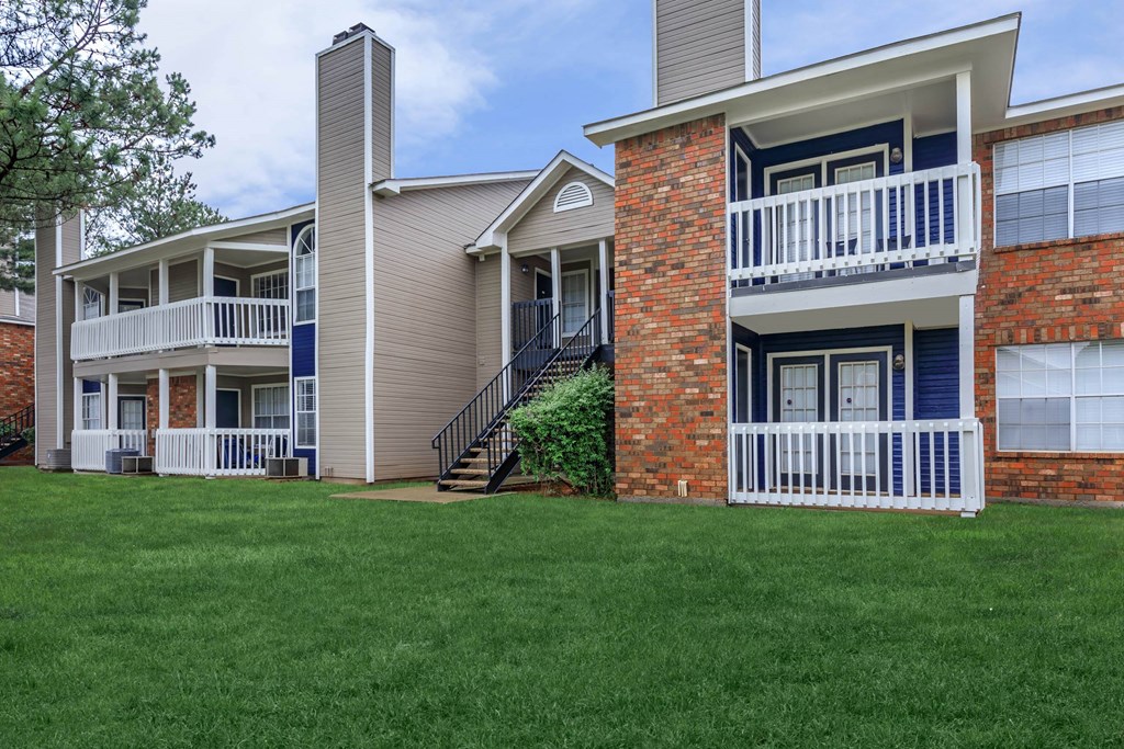 a view of a building with green grass in front of it at The Davis Apartments, Huntsville  