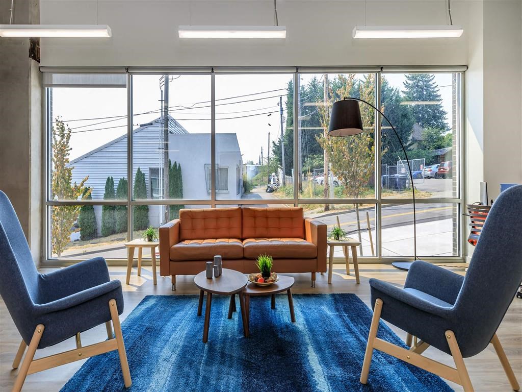 a living room with a couch and two chairs at Jefferson Yards, Washington, 98402