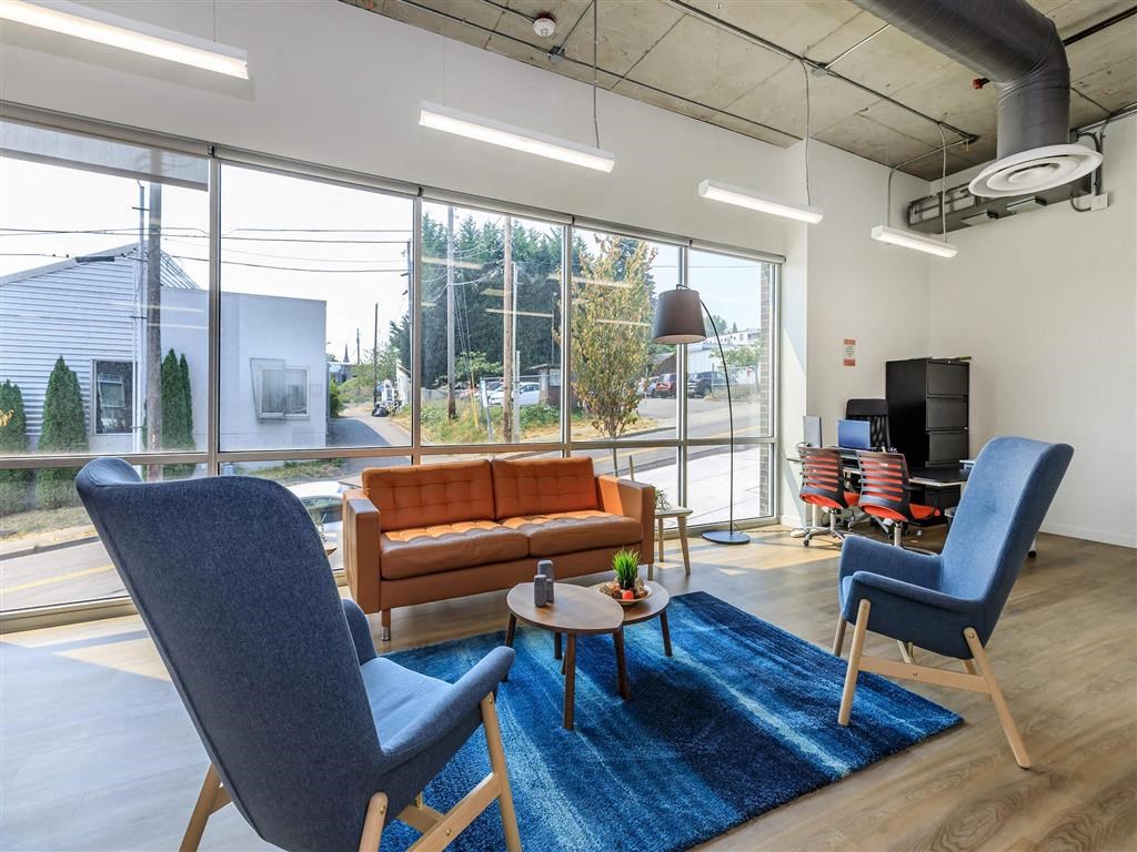 a living room filled with furniture and a large window at Jefferson Yards, Washington
