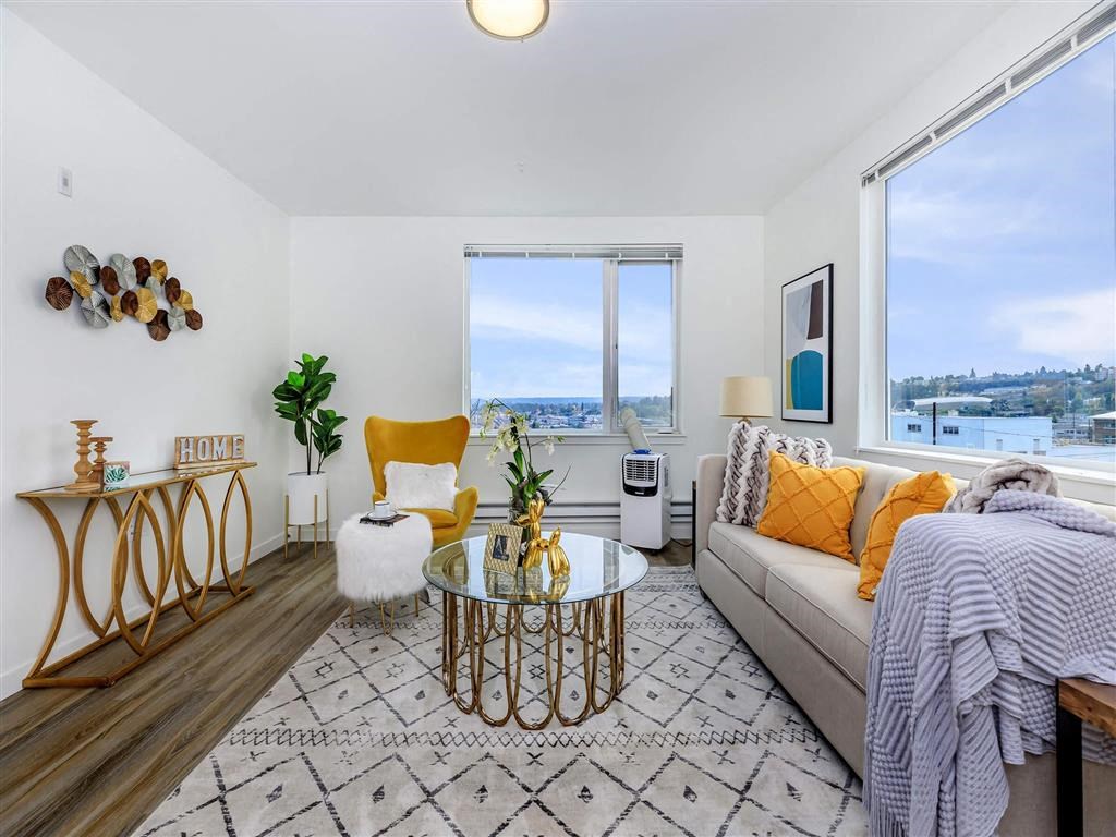 a living room with a couch and two windows at Jefferson Yards, Washington