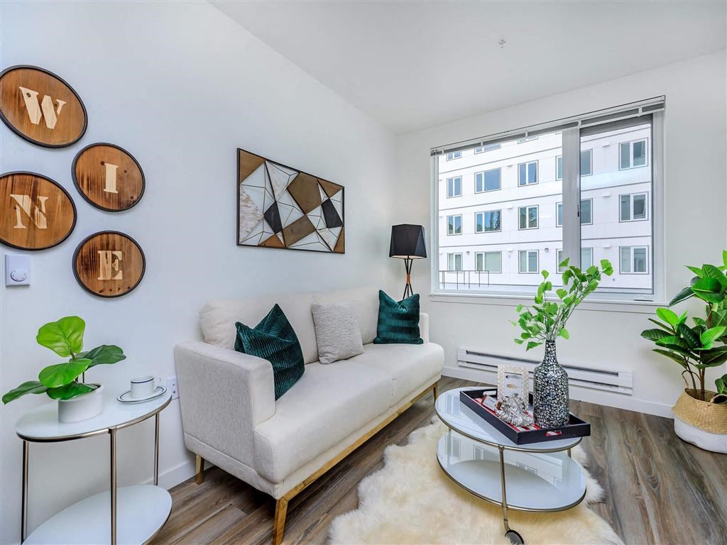 a living room with a couch and a table at Jefferson Yards, Tacoma