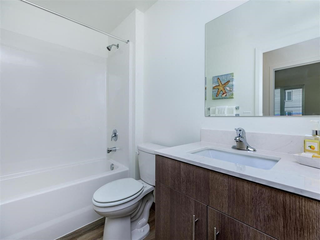 a bathroom with a sink toilet and bathtub at Jefferson Yards, Tacoma Washington