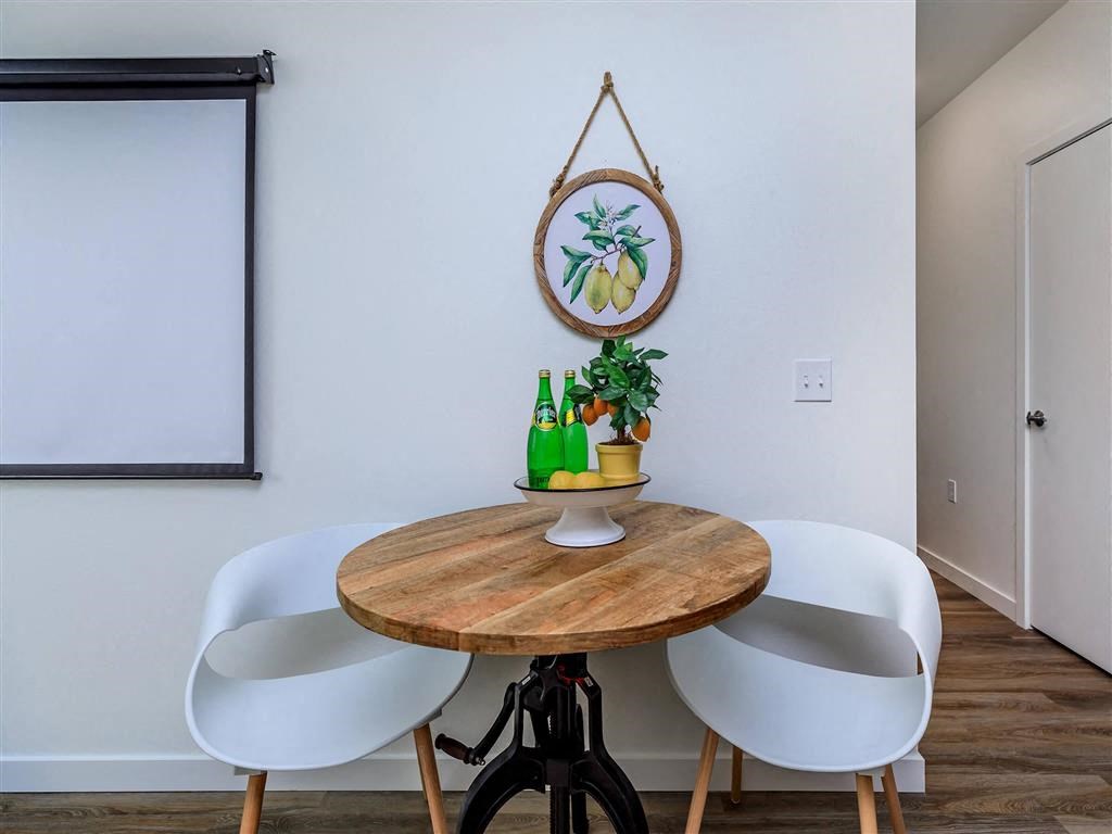 a dining room with a table and four chairs at Jefferson Yards, Tacoma Washington