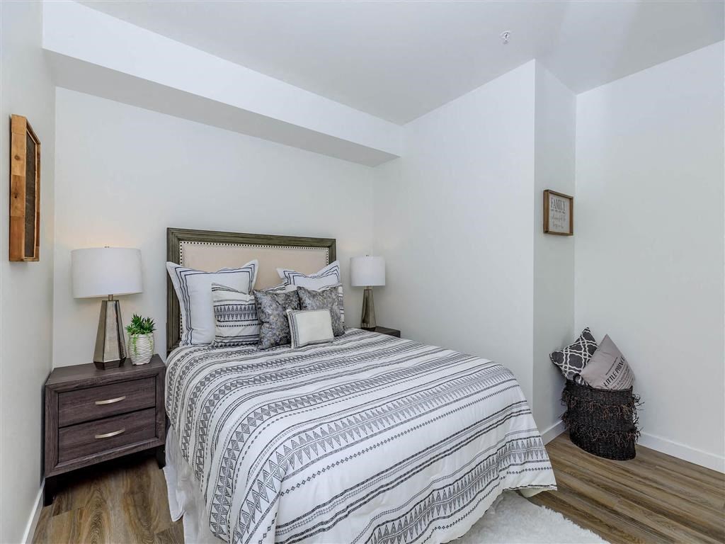 a bedroom with a bed and two night stands at Jefferson Yards, Washington
