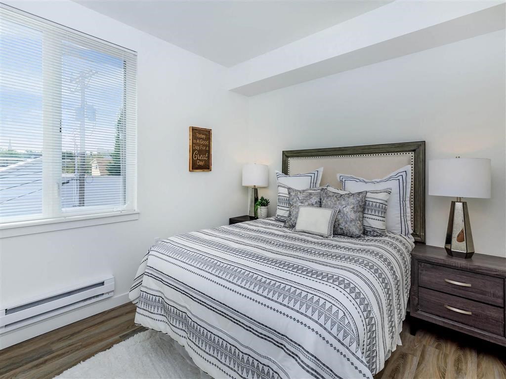 a bedroom with a bed next to a window at Jefferson Yards, Tacoma