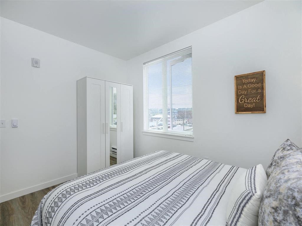 a bedroom with a large bed next to a window at Jefferson Yards, Tacoma, 98402