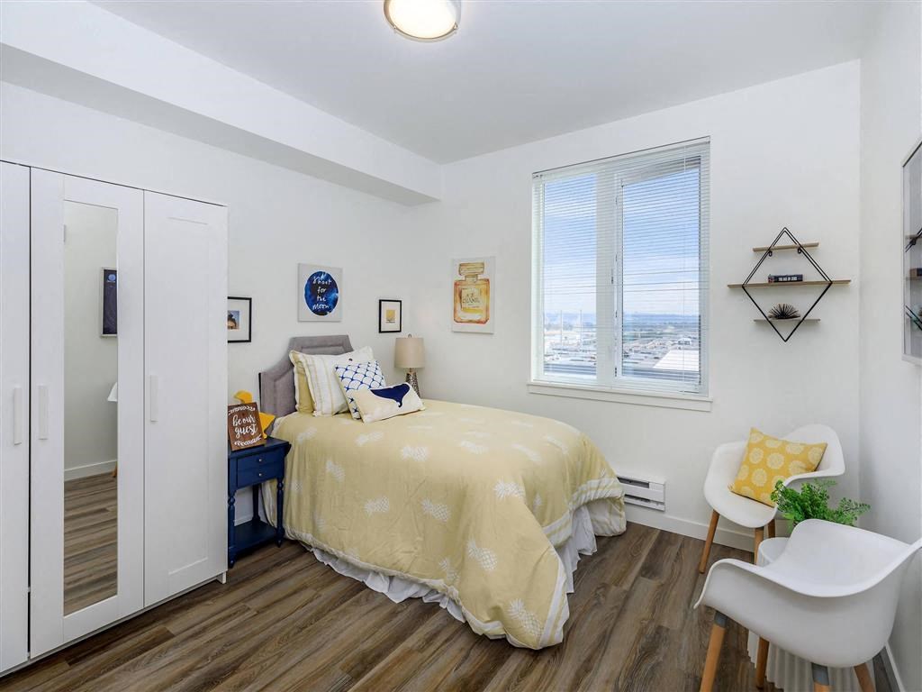 a bedroom with a bed next to a window  at Jefferson Yards, Tacoma, WA 98402