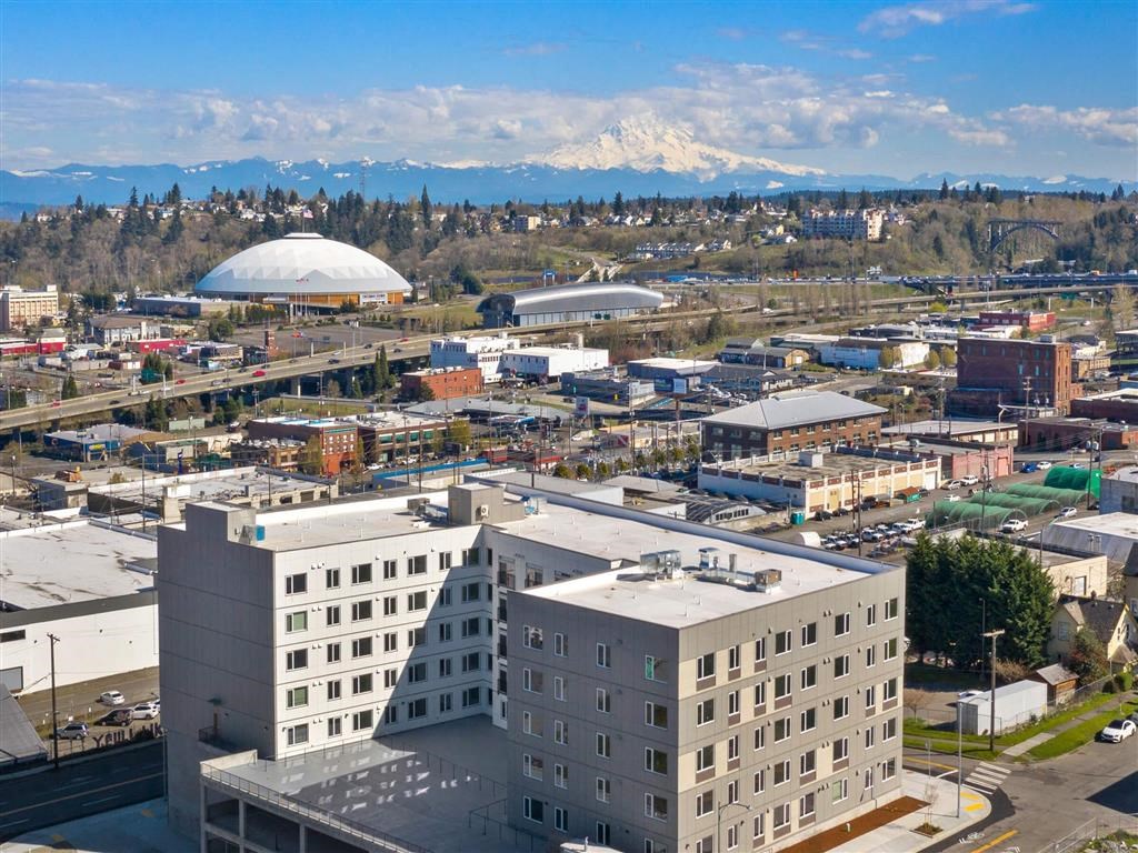 a cityscape with a large white building in the foreground and a large dome in the background at Jefferson Yards, Washington