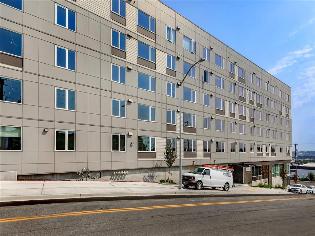 a van parked in front of a large building at Jefferson Yards, Tacoma, 98402
